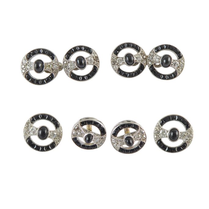 Early 20th century onyx and diamond dress set by Cartier, Paris c.1910, the set comprising a pair of cufflinks, two buttons and two studs, of openwork circular form, | MasterArt